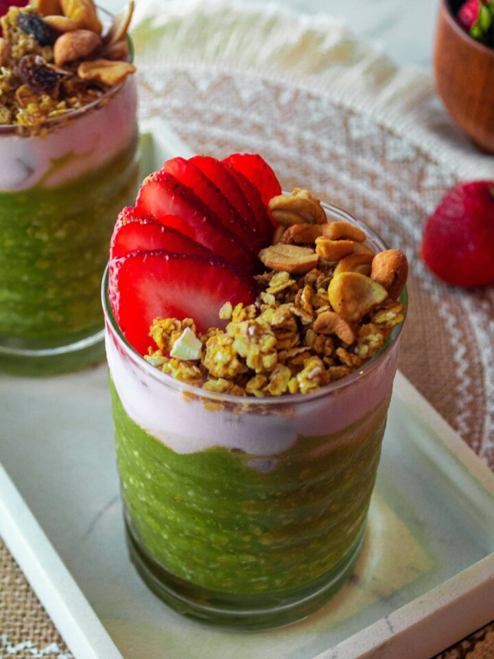 green overnight oats with nuts and strawberry