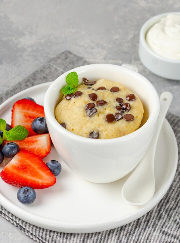 chocolate chip mug cake in a white cup